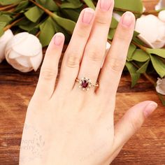 "(Please confirm your US size when you make an order) Jewelry Details Gold Type : 14k gold Center Stone: Lab Created Ruby 6*7mm, Approximately 1.53ct Color: 5A Clarity: VVS Cut: Cushion Cut / 3EX Side Stone: Natural Pearl, total 8pcs Band Width: approximately 1.2mm SKU: YR0466 ~*-*~Purchase Guarantee: - All our jewelry is handmade, and each process is refined. - 14 Day Refund Guarantee. - All our products are Free Shipping. - Free Gift Box&Packing. ~*-*~Please contact us if you need service: Wedding Ruby Ring With Halo Setting, Gold Halo Ring With Accent Stones As Gift, Gold Ruby Ring For Proposal, Gold Birthstone Ring With Halo Setting For Proposal, Gold Gemstone Crystal Proposal Ring, Gold Gemstone Cluster Ring For Proposal, Proposal Gold Ruby Rings, Gold Proposal Rings With Accent Stones, Gold Crystal Proposal Ring