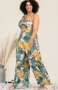 The Eden Leaf Print Jumpsuit is chic, stylish, and perfect for summer! It features a halter tie neck, a pyramid cut-out in the bodice, and wide-leg pants with pockets. You definitely need this jumpsuit for your next vacay! Material: 80% Rayon / 20% NylonModel is wearing a 1X. Floral Print Jumpsuit, The Eden, Print Jumpsuit, Pants With Pockets, Printed Jumpsuit, Wide Legs, Leaf Print, Tie Neck, Hottest Trends