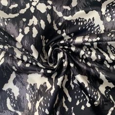 This posh silk/cotton satin is a black and white color. Unique for the extremely smooth and soft to the touch cotton/silk composition, this gorgeous print is fierce, fun, and refined. A popular choice for gowns, statement jackets, stand-out skirts and more. This fabric is not sheer, therefore a lining is not needed unless additional structure and modesty is desired. SKU: 6846 Content: Silk/Cotton Blend Color: Black And White Width: 58 inches Origin: Italy Note: this fabric is featured in a red c Elegant Patterned Silk Fabric, Statement Jackets, Hexagon Print, Jaguar Print, Statement Jacket, Fashion District, Black And White Fabric, Black And White Color, Black Sand