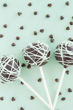 three chocolate covered lollipops sitting on top of each other