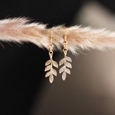 LEAF EARRINGS DESCRIPTION A simple yet stunning pair of elegant leaf dangles to grace your ears --pairs beautiful with a little black dress, or these days your favourite working-from-home loungewear. DETAILS * 20k gold or silver-plated metal; nickel-free. * Approximate pendant size: 25 mm. * Earring drop length: approximately 1.5 inches. * All earrings are final sale. * Designed and made in Ottawa, Ontario, Canada. NON-REFUNDABLE ITEM Please note that all earrings are non-refundable due to hygie Elegant Leaf-shaped Earrings, Elegant Leaf Shaped Earrings As Gift, Elegant Leaf-shaped Jewelry With Matching Earrings, Elegant Leaf-shaped Earrings For Gift, Elegant Hypoallergenic Jewelry As A Gift For Her, Elegant Hypoallergenic Jewelry Gift For Her, Elegant Everyday Earrings With Lever Back, Nature-inspired Everyday Jewelry With Matching Earrings, Elegant Hypoallergenic Earrings As Gift For Her