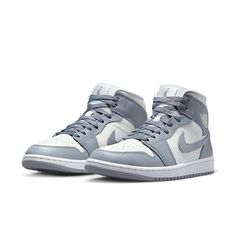 The iconic Air Jordan 1 Mid has been a staple of street style since its debut over two decades ago. Now, a new version brings the timeless design into modern fashion in grey sail tones. This sleek rendition offers an elevated, versatile style with subtle tones that are sure to stand out. The classic silhouette’s upper is crafted from quality leather and suede materials that luxuriously hug your foot for all-day comfort. The dark shade of grey makes the shoe versatile and wearable for any occasio Jordan 1 Mid Stealth, Air Jordan 1 Mid Grey, Jordan 1 Mid Women, Air Jordan Mid, Jordan Mid, Perfect Sneakers, Nike Air Jordan 1 Mid, Baskets Adidas, Jordan 2