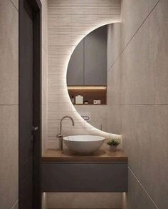 a bathroom sink sitting under a mirror next to a wall