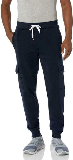 Southpole Men's Active Basic Jogger Fleece Pants, New Navy (Cargo), Medium Long fleece active jogger basic cargo pocket pants in solid colors and waist cord Features Fleece jogger pant featuring contrast drawstring at waist, flap-top cargo pockets, and banded cuffs Single patch pocket at back Fast and Free Shipping - Most Items Ship Same Day! We'll get your order shipped out same or next business day and delivered to your doorstep as quickly as possible. Competitive Pricing With our dynamic pric Navy Pants With Pockets For Winter, Winter Navy Bottoms With Pockets, Navy Bottoms With Pockets For Winter, Navy Sweatpants With Pockets For Sportswear, Navy Relaxed Fit Joggers For Streetwear, Navy Cotton Sweatpants With Pockets, Navy Relaxed Fit Cargo Pants With Pockets, Navy Relaxed Fit Sweatpants With Pockets, Functional 4-way Stretch Sweatpants With Pockets