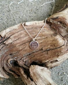 "Small 6mm sterling silver disk is hand stamped with your zodiac sign. The silver disk hangs delicately from a sterling silver chain with a sterling silver clasp. Shown here with the Virgo sign in 17\" length. Also available in gold as shown in the last photo and available here: https://www.etsy.com/listing/770303678/tiny-hammered-zodiac-necklace-gold-fill?ref=shop_home_active_2 *If you are unsure of the length you need, or would like to wear this item at different lengths, we now offer an adjus Dainty Silver Zodiac Sign Charm Necklace, Minimalist Sterling Silver Zodiac Necklace, Silver Zodiac Sign Charm Necklace With Round Pendant, Silver Zodiac Charm Necklaces, Sterling Silver Round Zodiac Sign Charm Necklace, Sterling Silver Zodiac Charm Necklaces, Silver Sterling Zodiac Sign Charm Necklace, Elegant Sterling Silver Zodiac Sign Necklace, Sterling Silver Zodiac Sign Necklace Gift