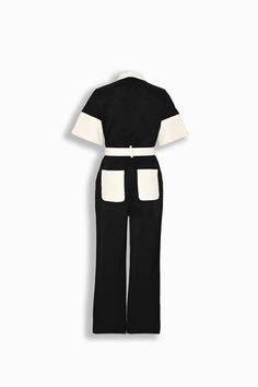 Our Arlo Jumpsuit, a belted jumpsuit with a band collar, open chest pockets, wide short sleeves, and straight-leg fit. Finished with a functional multi buttoned belt for adjustability and ivory back pockets. Cut from durable cotton fabric and secured with black buttons. Black and ivory coloring Midweight cotton fabric Band collar Front button closure Front and rear facing pockets Short dolman style sleeves 100% cotton Your order will ship from our warehouse in Florida, USA! Belted Jumpsuit, Florida Usa, Band Collar, Waist Pants, Ivory Color, Black Button, Shorts With Pockets, Chest Pocket, Occasion Wear