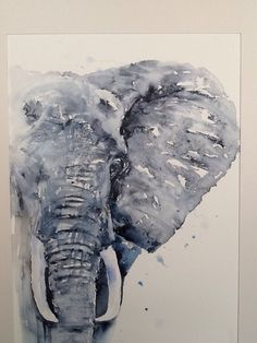 an elephant with tusks standing in front of a white wall and watercolor painting