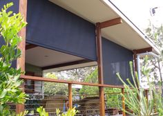 an outside view of a house with blue blinds