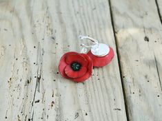 Red poppy earrings dangle, poppy jewelry gift, Remembrance day poppy poppy size 1/ 3/4'' (2,5/2cm) See also Poppy Necklace https://www.etsy.com/listing/222276025/red-poppy-necklacered-poppy-accessoryred?ref=shop_home_active_1 Please, keep the jewellery away from perfume and other alcohol containing fluids because the alcohol damages the Polymer clay. Store them the fragile items in separate boxes and treat them with care. Misuse may result in damage. Visit my shop https://www.etsy.com/shop/Jewel Red Birth Flower Earrings For Gift, Red Flower Earrings For Anniversary, Red Round Flower Earrings With Ear Wire, Red Flower-shaped Earrings For Anniversary, Red Flower Jewelry For Birth Flower, Elegant Poppy Colored Jewelry Gift, Red Round Jewelry With Flower Charm, Poppy Flower Shaped Jewelry Gift, Poppy Colored Flower Shaped Jewelry Gift