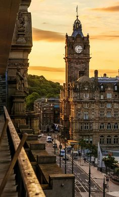 a large clock tower towering over a city