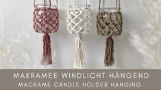 three glass jars with tassels hanging from the side and text marrame windlight hanger macrame candle holder hanging