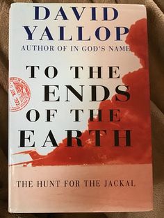 the book to the ends of the earth by david yallop is laying on a bed