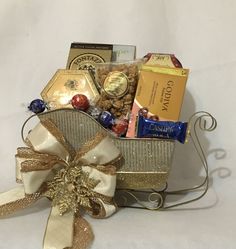 a gift basket filled with chocolates, candy and candies