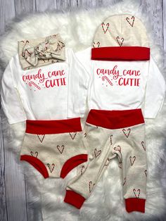 Get your little one holiday ready with this set! This adorable baby outfit has two options: chic high waisted bummies with a matching bodysuit and baby bow headband OR soft and stretchy lightweight baby jogger pants with a matching bodysuit and soft knit hat. Items are also able to be purchased separately so you have lots of styling options! ♥ ABOUT THIS SET ⚬ Sizes 0-3 months to 18-24 months. ⚬ Made of soft and stretchy knit fabric that feels great to the touch, wears well and looks fabulous. ⚬ Cute Fitted Christmas Sets, Cute Fitted Sets For Holiday, Cute Fitted Holiday Sets, Cute Cotton Onesie For Holidays, Cute Red Onesie For Loungewear, Cute Cotton Christmas Onesie, Cute Christmas Cotton Onesie, Cute Christmas Onesie, Candy Cane Cutie