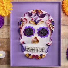 a decorated sugar skull sitting on top of a table