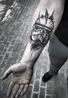 a man's arm with a tattoo on it that has a ship in the middle