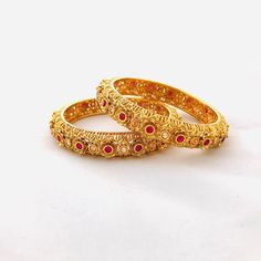 "2.6 Ruby Kundan Kada/Golden Kundan bangles/Handcarved Bangles/Jadau Bangles/Kundan Bridal bangle/Kundan wedding jewelry@AryaFashions This bangles set is handcrafted with love and creativity and are perfect for any occasion may it be engagement, Wedding or any bridal ceremonies or social get-together. Pair them up with Indian traditional outfit such as Anarkalis, Lehengas or Sarees and be the \"Diva\" at your next special occasions, or party. Handcrafted To Perfection Light Weight Perfect For In Marriage Bangle With Intricate Design, Wedding Bangle Openable, Wedding Tilla Bangle, Festive Wedding Bangle With Tilla Detail, Wedding Bangle With Cutdana For Diwali, Traditional Marriage Bangle With Intricate Design, Festive Bridal Bangle Sets For Diwali, Festive Bridal Bangle Set With Intricate Design, Festive Wedding Bangle With Pallu