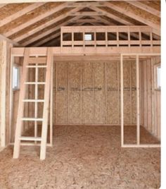 the inside of a house being built with wooden framing and ladders on the floor