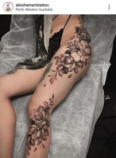 a woman's leg with flowers on it