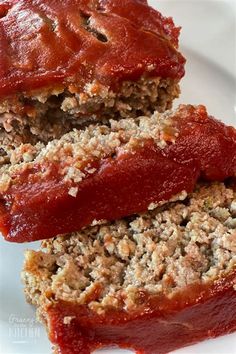 two slices of meatloaf on a white plate