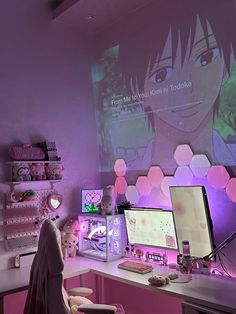 a desk with two computer monitors and a teddy bear sitting on the chair in front of it