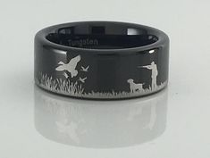 an image of a ring with ducks in the grass and a man holding a dog