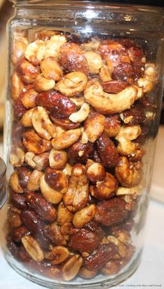 a jar filled with nuts sitting on top of a table