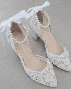 Classic and elegant almond toe heels in crochet lace with added pearl applique and pearl straps. Elegance and classic inspired wear for your special day.DETAILS:HEELS: 2.75 inchesCOLORS AVAILABLE: Ivory, White and Light BlueUPPER: Synthetic upper and liningMATERIALS: Manmade outsoleORIGIN: ImportedSTYLE NAME: ABBY Shoes Block Heels, Pearl Applique, Pearl Straps, Women Wedding Shoes, Bridesmaids Shoes, Shoes Details, Wedding Shoes Lace, Headband Jewelry, White Wedding Shoes