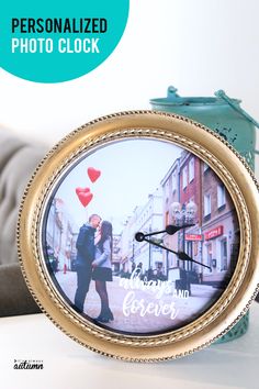 a personalized clock with a couple kissing on the street in front of a blue vase