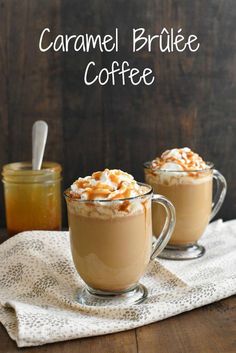 caramel brulee coffee in two mugs with whipped cream on top