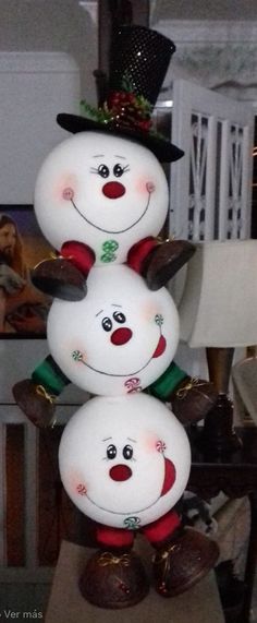 three snowmen are stacked on top of each other