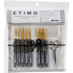 a set of scissors and some other items in a bag on a white background with the words etimo