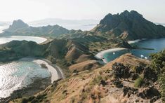 an aerial view of some mountains and water