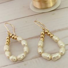 "Teardrop Pearl Earrings  These beautiful earrings were specially designed to complement the outfit of a woman and give her a look very chic and elegant. They are lightweight and very comfortable for all day wearing, made with gold plated wire, gold plated beads and freshwater pearls in a beautiful teardrop shape. They are a fantastic option as a bridesmaid gift and a really cute pearl bridal jewelry piece.  If you buy this unique and wonderful piece, you will feel the love that I feel when I'm Everyday Teardrop Earrings With Pearl Charm, Dainty Pearl Teardrop Hoop Earrings, Delicate Teardrop Hoop Earrings With Pearl Charm, Elegant Teardrop Hoop Earrings With Pearl Charm, Hypoallergenic Pearl Teardrop Hoop Earrings, Hypoallergenic Teardrop Pearl Hoop Earrings, Teardrop Pearl Charm Earrings For Anniversary, Teardrop Pearl Hoop Earrings With Pearl Charm, Everyday Dangle Teardrop Earrings With Pearl Drop