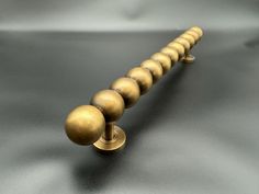 Twelve Ball Door Pull (36cm) Dimensions 36 x 3.5 x 5.7 ( LxWxH | centimeters ) or 14.17 x 1.38 x 2.24 ( LxWxH | inches ) or 360 x 35 x 57 ( LxWxH | millimeters ) Weight  667 grams or 0.667 kilograms or 23.83 ounces Materials  Handmade Brass Sold as an individual item, not as a pair therefore the price is per handle. Care Guide  https://bronzebetty.co/pages/caring-for-bronze' target='_blank' rel='noopener noreferrer'>Caring for bronze Unique Houses, Door Pull, Handmade Brass, Brass Door, Door Pulls, Kitchen Layout, Drawer Knobs, Shower Doors, Moldings And Trim