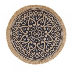 a round rug with an intricate design on the bottom and fringes in the middle