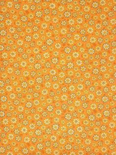 an orange and yellow background with small flowers