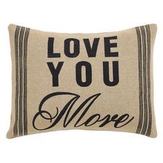 the love you more pillow is shown in black and beige with an embroidered message on it