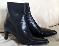 Elevate your shoe collection with these handmade black leather ankle boots from Galo, crafted with care in Italy. These boots feature a standard shoe width, with a 2.75-inch heel height and a secure zip closure for easy wear. The leather lining and insole provide comfort and durability, while the rubber outsole ensures traction on any surface. Perfect for any occasion, these boots are a must-have for any fashion-forward woman. The solid pattern and ankle length make them versatile enough to wear Black Leather Ankle Boots, Stylish Boots, Easy Wear, Boot Shoes Women, Shoe Collection, Bootie Boots, Fashion Forward, Heel Height, Ankle Boots