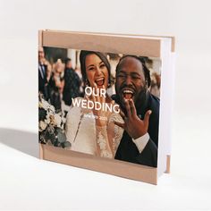 a wedding card with the words our wedding printed on it and an image of a bride and groom