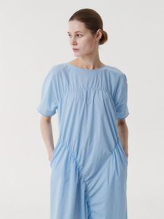 This is a clean and casual dress by EAAH that is made out of high quality and sturdy fabric. With unique design detail and trendy mood, you can style it for your refined and casual daily outfit.- Button and loop closure on the back- Side seam pocket detail- High quality sea shell button- Shirring detail Modern Blue Dress For Summer, Modern Blue Summer Dress, Modern Cotton Daywear Dress, Modern Cotton Dresses For Daywear, Light Blue Relaxed Fit Dress For Daywear, Blue Relaxed Fit Midi Dress For Work, Relaxed Fit Blue Midi Dress For Work, Modern Cotton Midi Dress For Summer, Side Seam Pocket