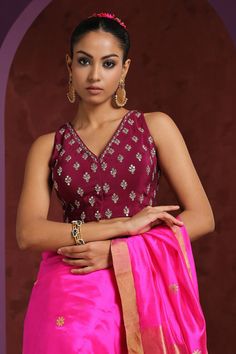 Wine saree blouse with hand embroidered zardozi floral motifs.
Component: 1
Pattern: Embroidery
Type Of Work: Zardozi
Neckline: V neck
Sleeve Type: Sleeveless
Fabric: Crepe
Color: Wine
Other Details: 
Low back with tie up and tassels
Closure: Front hook
Note: Saree worn by the model is not for sale
Occasion: Sangeet - Aza Fashions Wine Saree, Wine Blouse, Embroidery Zardozi, Saree Blouses Online, Buy Wine, Pattern Embroidery, Blouse For Women, Blouse Online, Floral Motifs