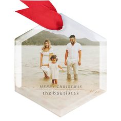 a christmas ornament with an image of a family on it