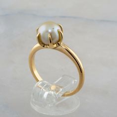 14K Yellow Gold 7mm Pearl Ring, Ring size 5.75, 3.2 grams Stock # BB295R02 Most rings are sizable for a small fee. If the ring you are considering is the incorrect size contact us for a quote. This listing contains photographs of the actual item you will receive. Our items are in excellent condition with little or no signs of wear and many are one of a kind pre-owned estate finds. Please look closely at the pictures in this listing as they are part of the product description. Please read the des Pearl Accessories, Boston Ma, Ring Ring, Pearl Ring, Solitaire Ring, Boston, Pearl Earrings, Ring Size, Yellow Gold