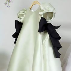 Green Silk with Black Cotton Ribbon Bows: Eco-friendly, breathable and Hypoallergenic material. Care: Hand Wash Only Perfect Gift for birthdays, holidays, or just to make any day special for the little one in your life. Elegant Green Girls' Formal Dress, Flower Girl, Princess Dress, Wedding Dress Green Short Sleeve Princess Dress For Party, Black Princess Dress For Dress-up In Spring, Black Princess Dress For Spring Dress-up, Spring Green Princess Dress With Short Sleeves, Black Princess Dress For Dress-up And Spring, Black Sleeveless Dress For Birthday, Sleeveless Black Dress For Birthday, Black Princess Dress With Ruffles For Birthday, Elegant Black Princess Dress For Birthday