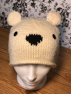 a knitted bear hat on top of a head