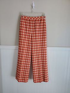 "Vintage Jantzen  plaid, off white, redish , 70's  Polyester machine wash. Label size: 14 Measurements; Waist: 28\" Inseam: 30\" Hips: 42\" Total length: 42\" Ankle width: 12\" across  this pants have a very wide hem (3 inches) can be altered for a longer Inseam. Condition: Great vintage condition" Wash Label, Vintage Trousers, Mens Trousers, Label Sizes, Made In The Usa, Mens Pants, Gender Neutral, Adult Outfits, Trousers