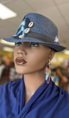 The mudcloth blue and Art Deco has endless possibilities.This African Print Fedora is beautiful and unisex. The fedora looks great for the summer with a touch of cowrie shell. Comfortable fits small to med size heads.Don't delay order yours today. Artisan Blue Fedora With Short Brim, Blue Bohemian Fedora With Short Brim, Artisan Blue Fedora Hats, Unique Fedora With Short Brim For The Beach, Unique Short Brim Fedora For The Beach, Unique Short Brim Fedora For Beach, Bohemian Blue Fedora With Flat Brim, Blue Bohemian Fedora With Flat Brim, Artisan Blue Fedora For Festivals