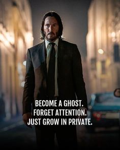 a man in a suit and tie walking down the street with a caption that reads, become a ghost forget attention just grow in private