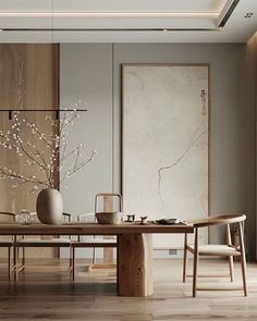 a dining room table with vases on top of it and two chairs around it